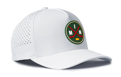 white performance 5-panel hat viewed from the right side, showcasing a bold green, red and gold pvc patch prominently displayed on the front