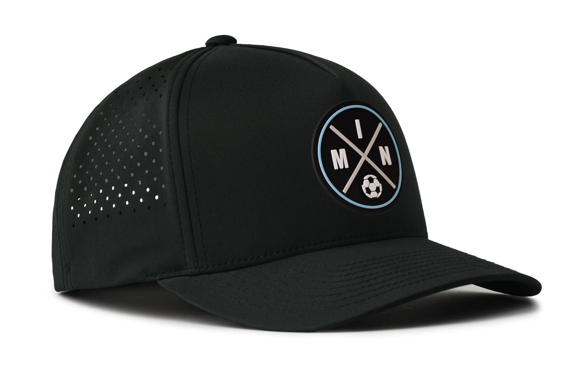 black performance 5-panel hat viewed from the right side, showcasing a bold black and blue pvc patch prominently displayed on the front