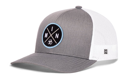 Minnesota Soccer Trucker Hat, gray-white snapback showing Haka brandmark on left side of cap.