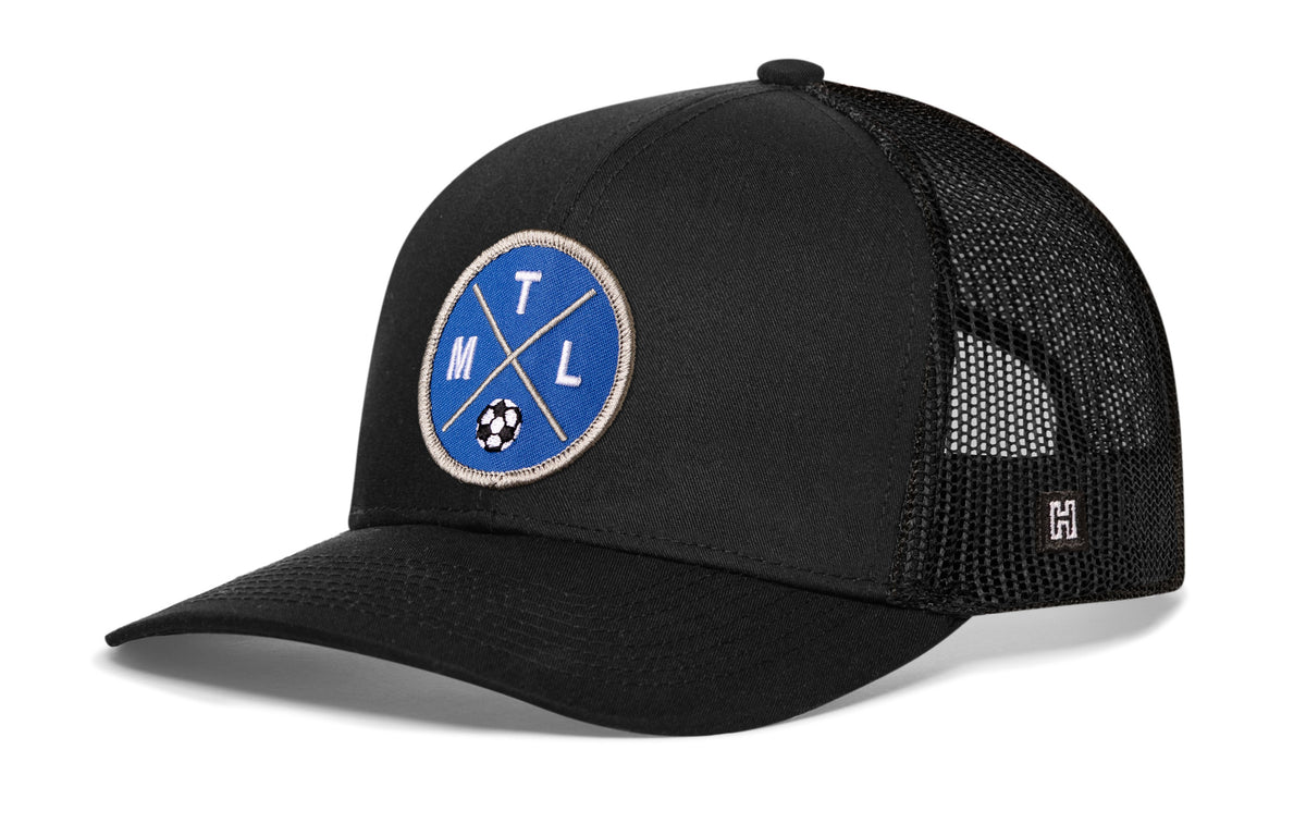 Montreal Soccer Trucker Hat, black snapback showing Haka brandmark on left side of cap.