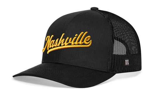 Nashville Trucker Hat, black snapback showing Haka brandmark on left side of cap.