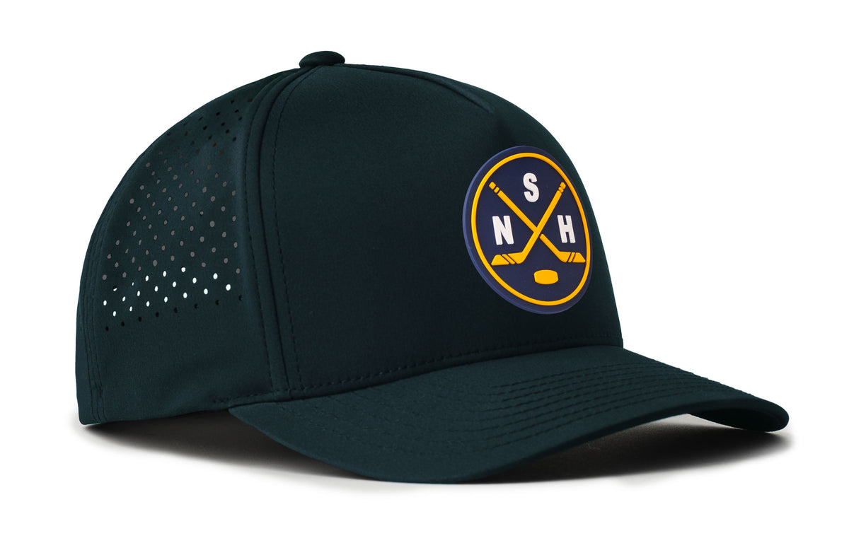 navy performance 5-panel hat viewed from the right side, showcasing a bold navy and gold pvc patch prominently displayed on the front