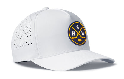 white performance 5-panel hat viewed from the right side, showcasing a bold navy and gold pvc patch prominently displayed on the front