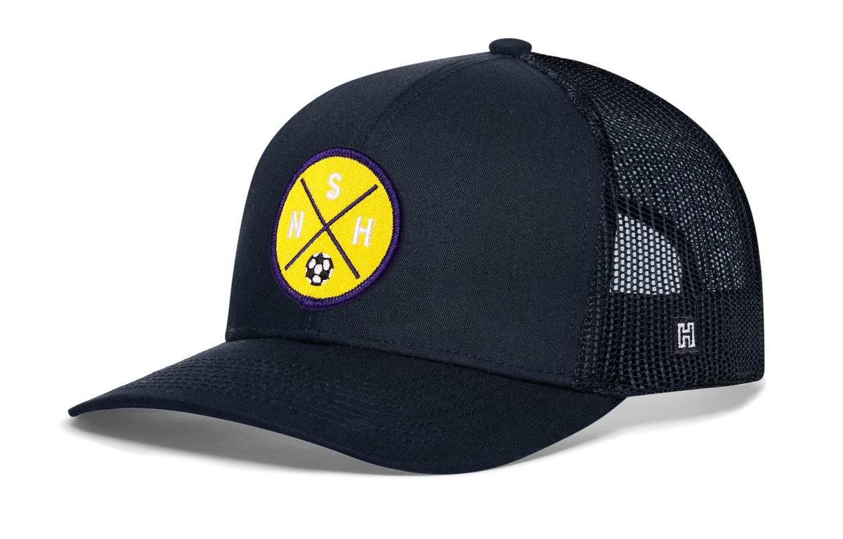 Nashville Soccer Trucker Hat, navy snapback showing Haka brandmark on left side of cap.