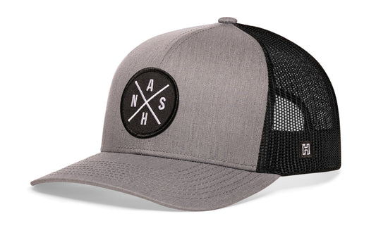 Nashville Trucker Hat, gray-black snapback showing Haka brandmark on left side of cap.