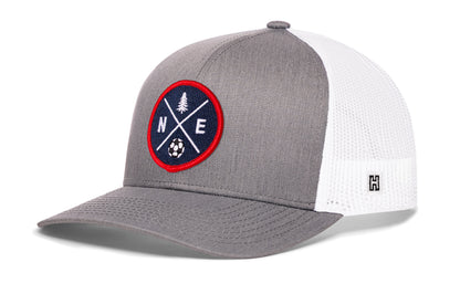 New England Soccer Trucker Hat, gray-white snapback showing Haka brandmark on left side of cap.