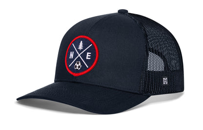 New England Soccer Trucker Hat, navy snapback showing Haka brandmark on left side of cap.
