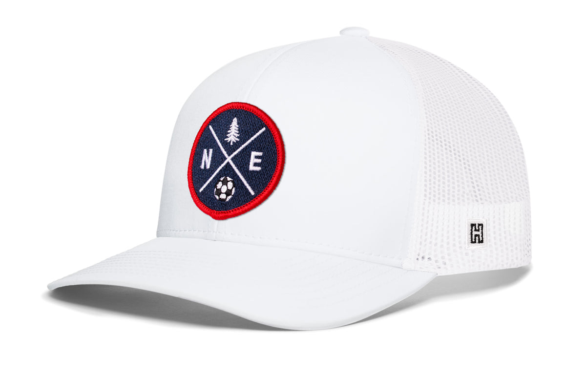 New England Soccer Trucker Hat, white snapback showing Haka brandmark on left side of cap.