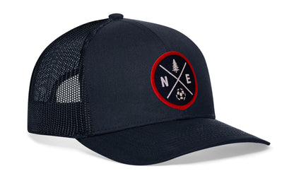 navy trucker hat viewed from the right side, showcasing a bold red and blue embroidered X patch prominently displayed on the front
