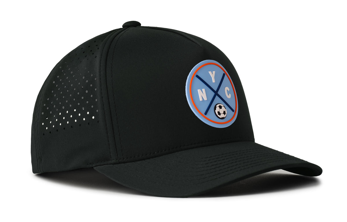 black performance 5-panel hat viewed from the right side, showcasing a bold sky blue and orange pvc patch prominently displayed on the front