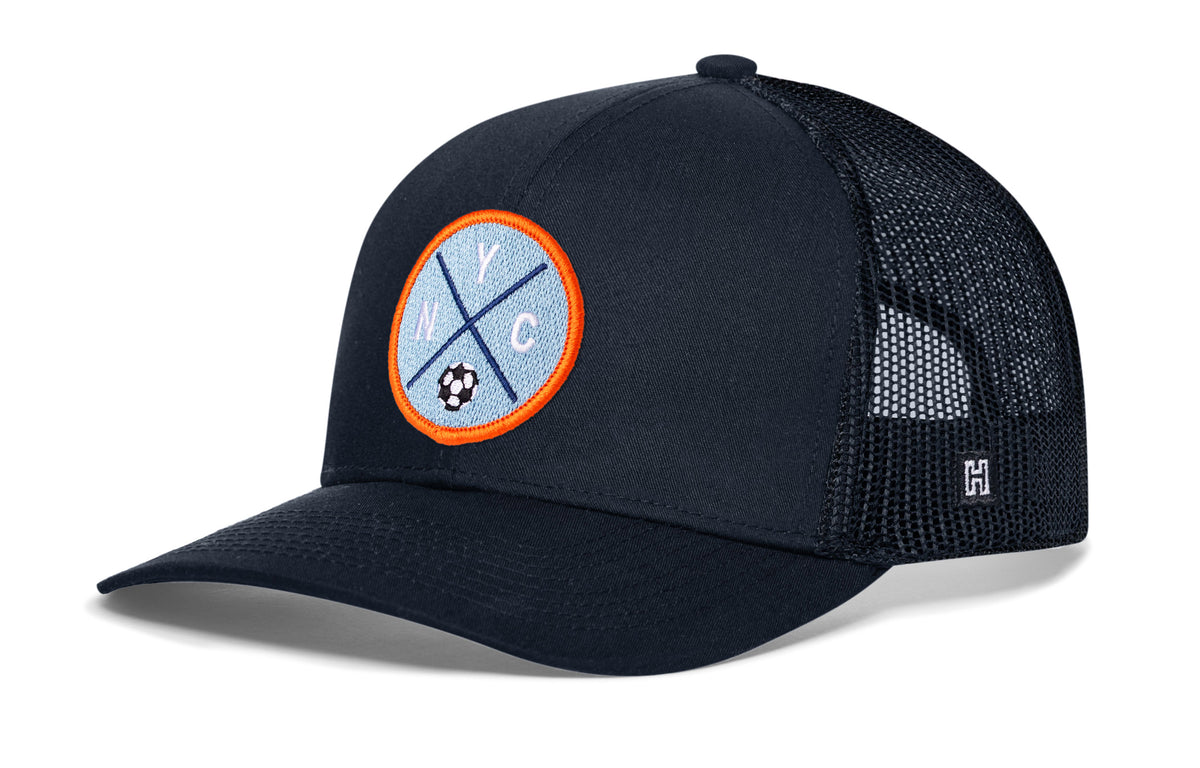 New York City Soccer Trucker Hat, navy snapback showing Haka brandmark on left side of cap.