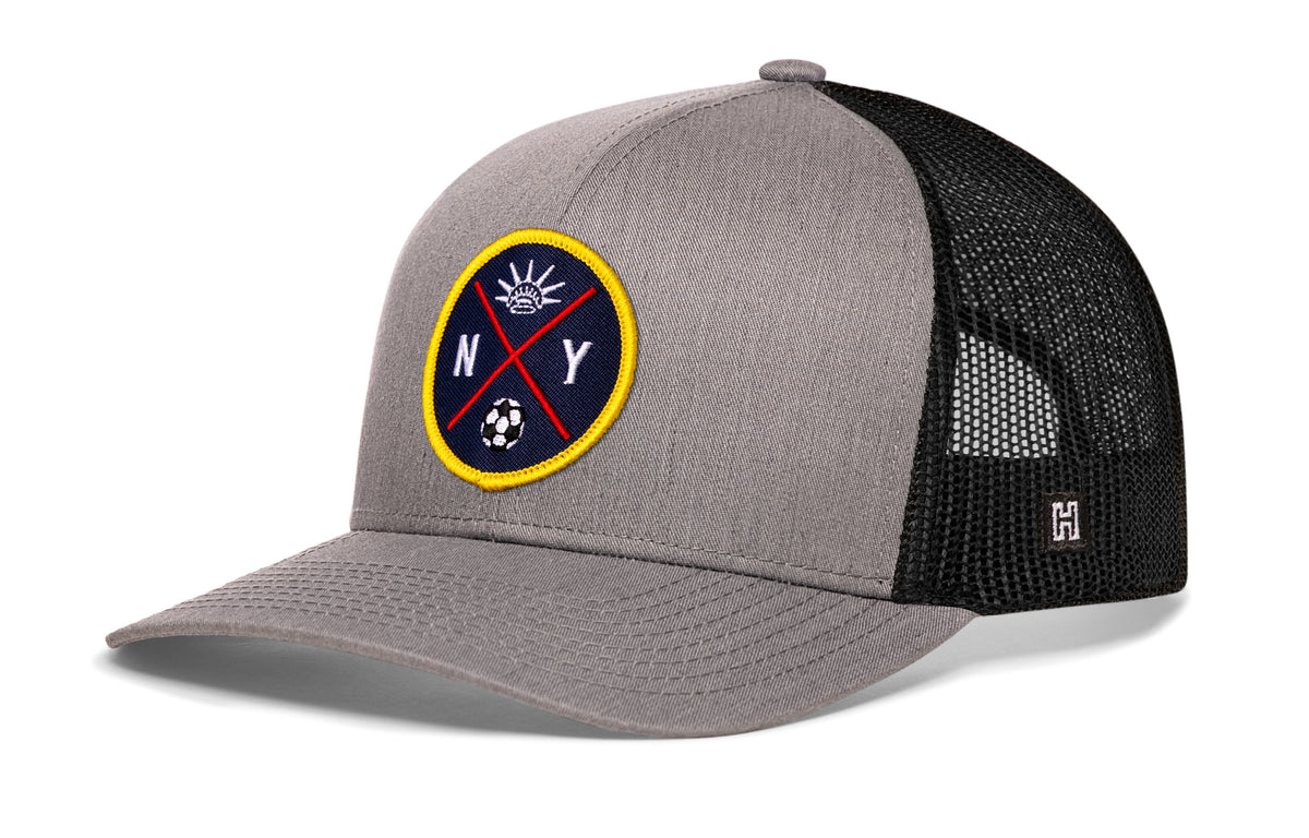 New York City Soccer Trucker Hat, gray-black snapback showing Haka brandmark on left side of cap.