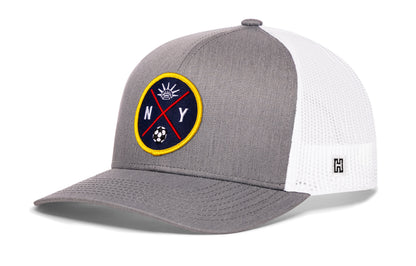 New York City Soccer Trucker Hat, gray-white snapback showing Haka brandmark on left side of cap.