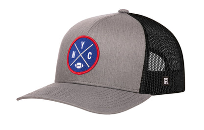 New York Football Trucker Hat, gray-black snapback showing Haka brandmark on left side of cap.