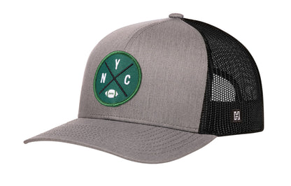 New York Football Trucker Hat, gray-black snapback showing Haka brandmark on left side of cap.