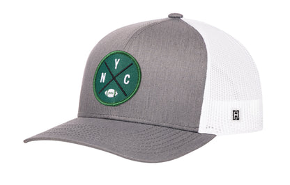 New York Football Trucker Hat, gray-white snapback showing Haka brandmark on left side of cap.