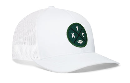 white trucker hat viewed from the right side, showcasing a bold green, white and black embroidered X patch prominently displayed on the front