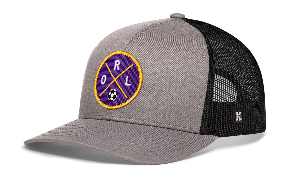 Orlando Soccer Trucker Hat, gray-black snapback showing Haka brandmark on left side of cap.