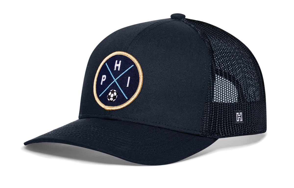 Philadelphia Soccer Trucker Hat, navy snapback showing Haka brandmark on left side of cap.