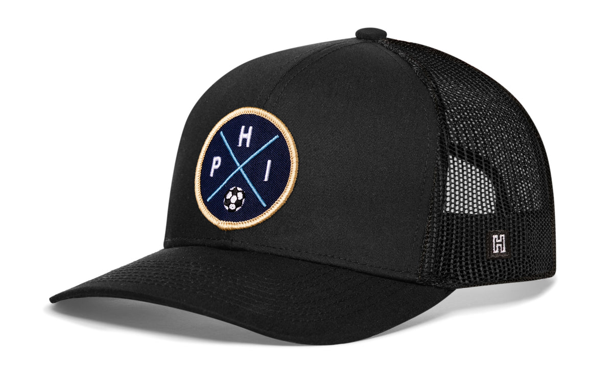 Philadelphia Soccer Trucker Hat, black snapback showing Haka brandmark on left side of cap.