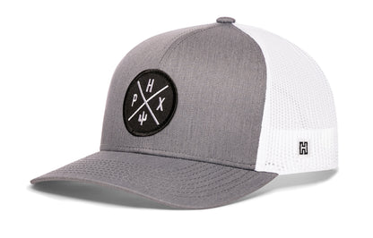 Phoenix Trucker Hat, gray-white snapback showing Haka brandmark on left side of cap.
