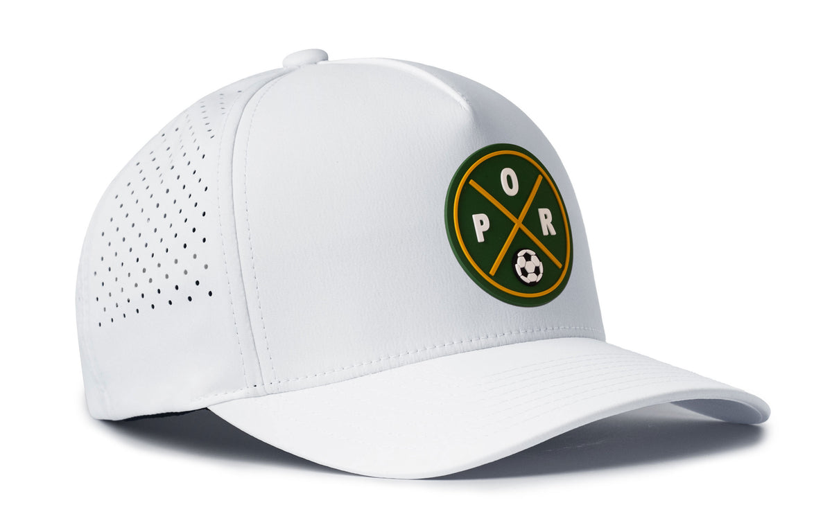 white performance 5-panel hat viewed from the right side, showcasing a bold forest green and gold pvc patch prominently displayed on the front
