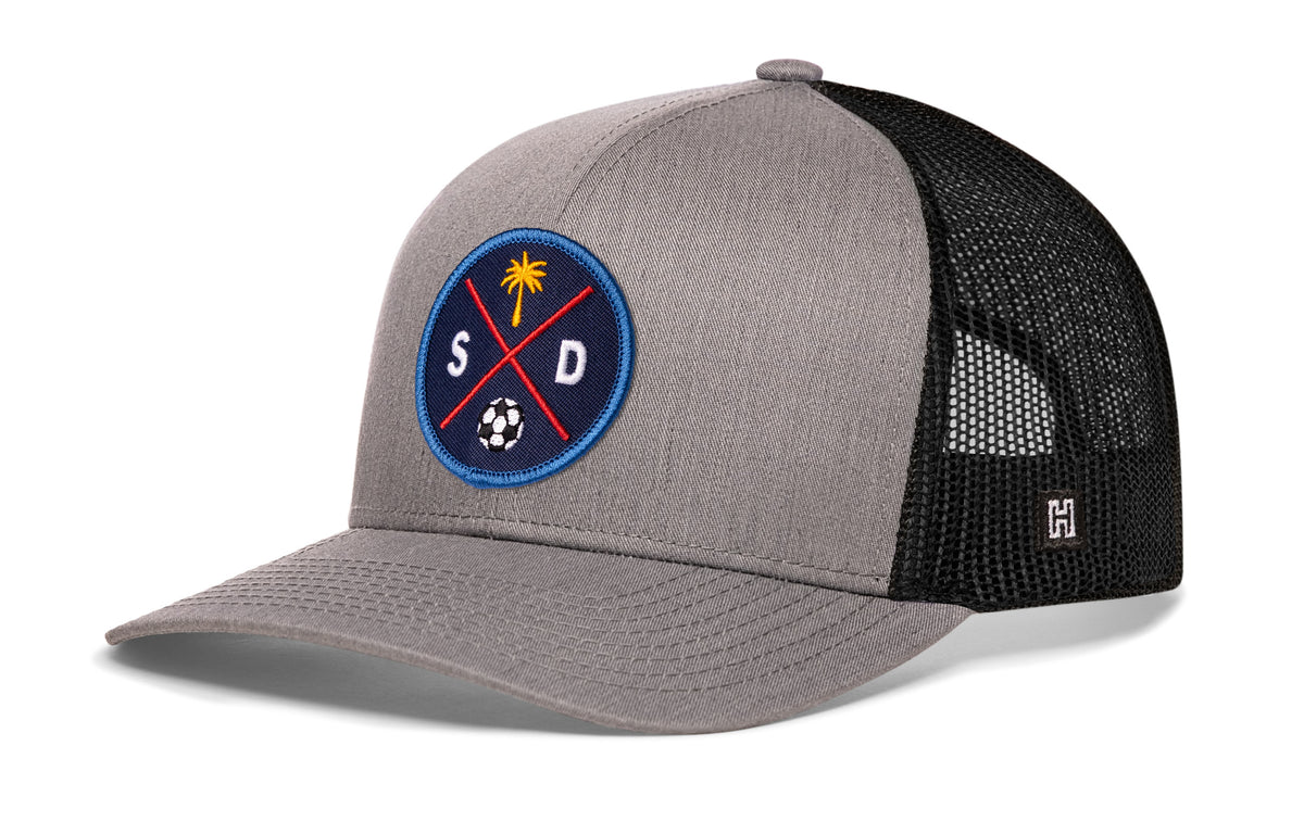 San Diego Soccer Trucker Hat, gray-black snapback showing Haka brandmark on left side of cap.