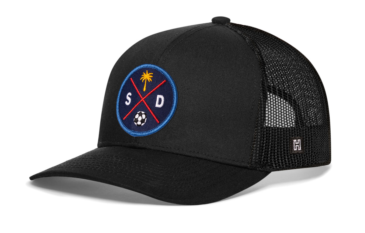 San Diego Soccer Trucker Hat, black snapback showing Haka brandmark on left side of cap.