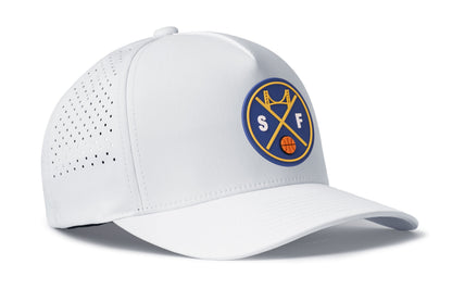 white performance 5-panel hat viewed from the right side, showcasing a bold royal blue and gold pvc patch prominently displayed on the front