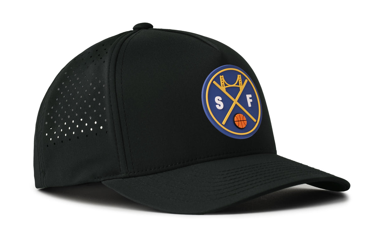 black performance 5-panel hat viewed from the right side, showcasing a bold royal blue and gold pvc patch prominently displayed on the front