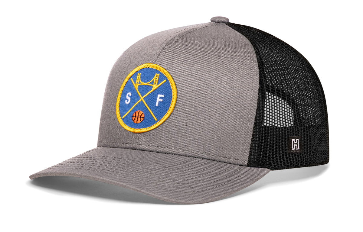 San Francisco Basketball Trucker Hat, gray-black snapback showing Haka brandmark on left side of cap.