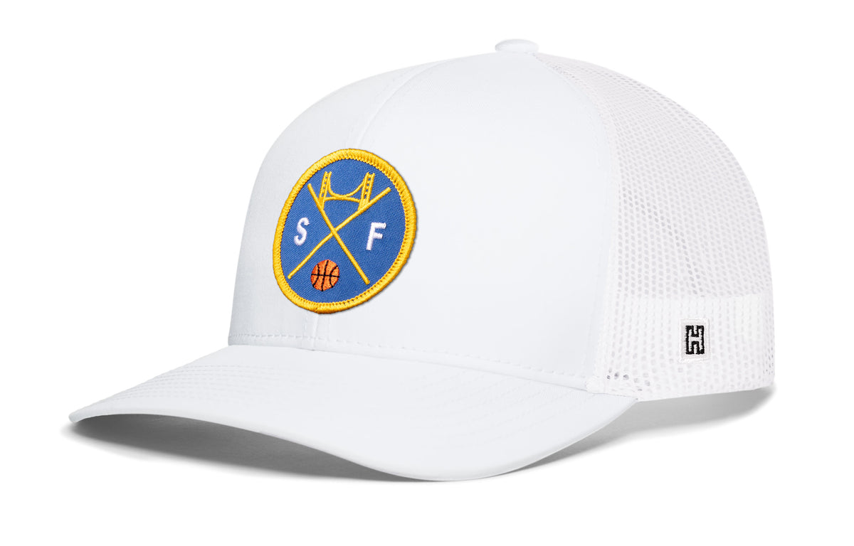 San Francisco Basketball Trucker Hat, white snapback showing Haka brandmark on left side of cap.