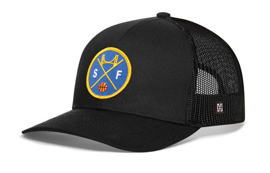 San Francisco Basketball Trucker Hat, black snapback showing Haka brandmark on left side of cap.