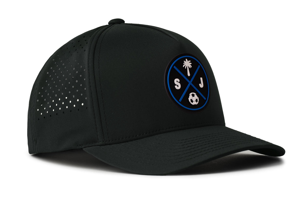black performance 5-panel hat viewed from the right side, showcasing a bold black and blue pvc patch prominently displayed on the front