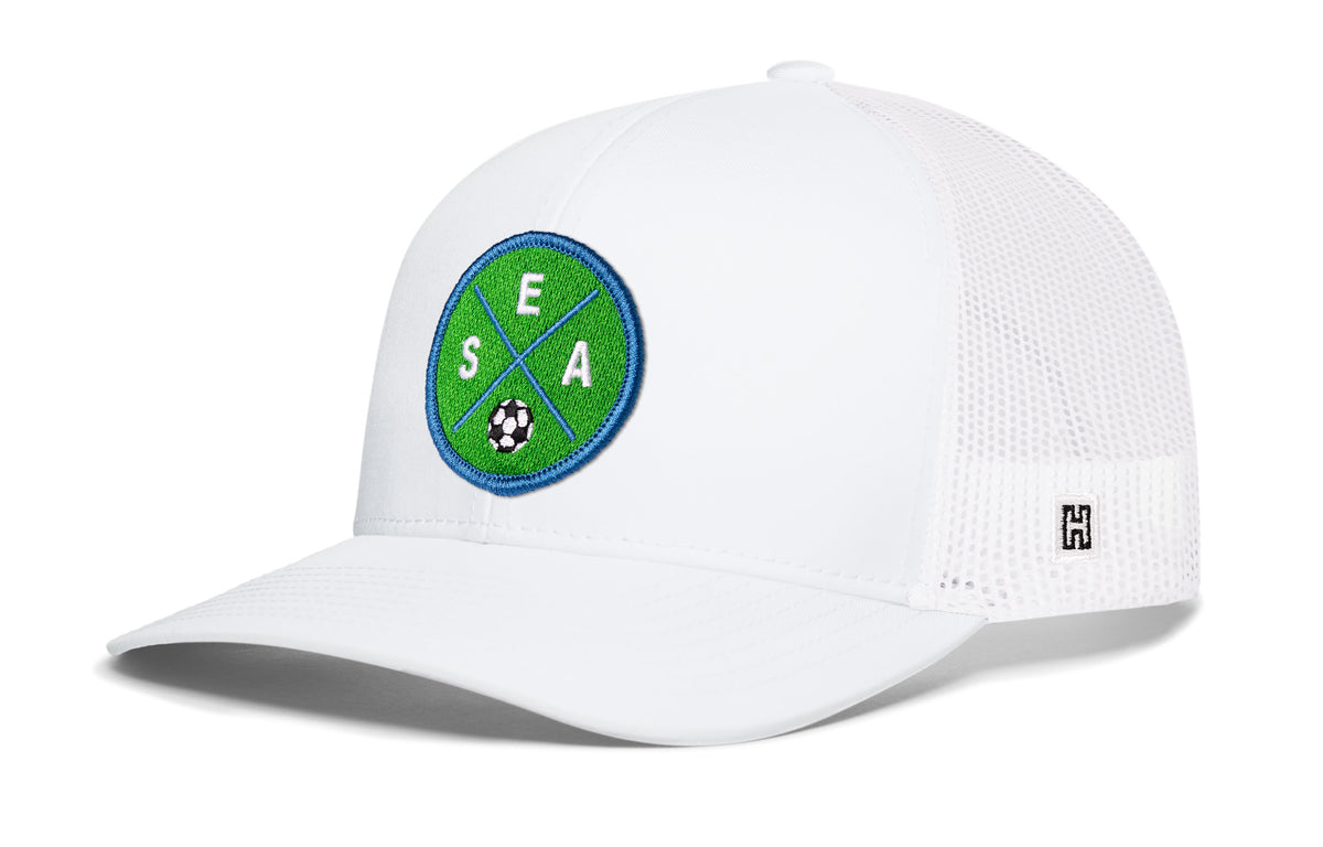 Seattle Soccer Trucker Hat, white snapback showing Haka brandmark on left side of cap.