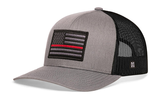 Thin Red Line Trucker Hat, gray-black snapback showing Haka brandmark on left side of cap.