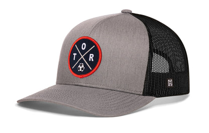 Toronto Soccer Trucker Hat, gray-black snapback showing Haka brandmark on left side of cap.