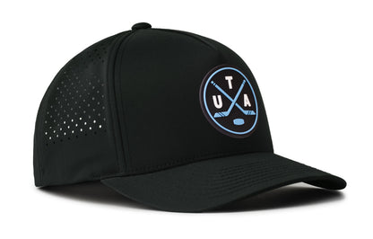 black performance 5-panel hat viewed from the right side, showcasing a bold navy and columbia blue pvc patch prominently displayed on the front