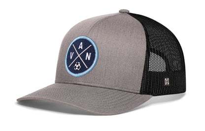 Vancouver Soccer Trucker Hat, gray-black snapback showing Haka brandmark on left side of cap.