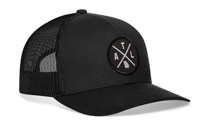 Black trucker hat viewed from the right side, showcasing a Atlanta ATL X Embroidered Circle Patch prominently displayed on the front