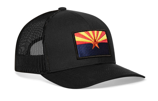 Black trucker hat viewed from the right side, showcasing a Arizona Flag Embroidered Rectangle Patch prominently displayed on the front