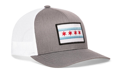 Gray-White trucker hat viewed from the right side, showcasing a Chicago Flag Embroidered Rectangle Patch prominently displayed on the front
