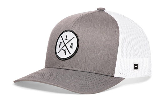 Gray-White trucker hat viewed from the right side, showcasing a Florida FLA X Embroidered White Circle Patch prominently displayed on the front