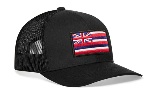 Black trucker hat viewed from the right side, showcasing a Hawaii Embroidered Rectangle Patch prominently displayed on the front